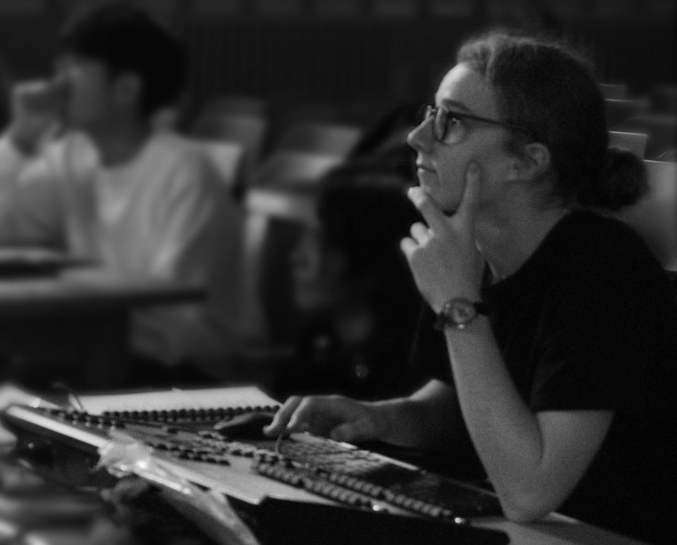 Charlie Newman at a lighting console during a technical rehearsal